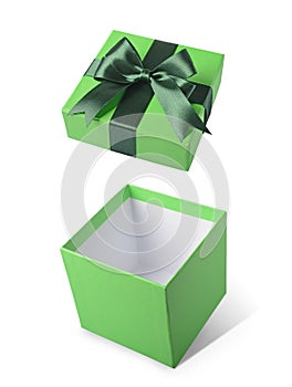 Green flying open gift box with satin bow