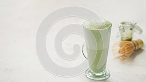 Green foam texture of matcha latte, close up