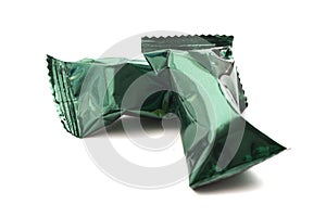 Green Foil Wrapped Chocolate Truffles Isolated on a White Background