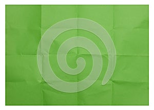 Green folded sheet of paper on isolated background