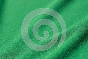 Green folded textile background