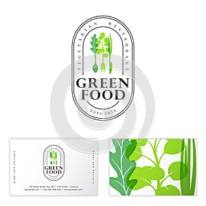 Green food emblem. Vegetarian restaurant logo. Cutlery with handles in the shape of leaves.