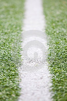 Green football field and a soccer field`s Line