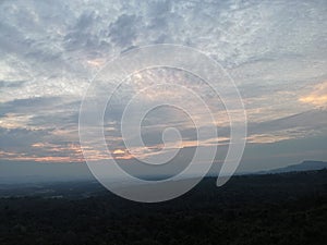 A green forest with sky background and blue white cloud in the morning at Bung Kan, Thailand.