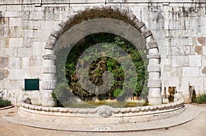 Green fountain in the San Pedro de Alcantara Garden. Lisbon. Portugal.