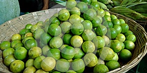 green fresh organic produce lemon kept on basket at vegetable store