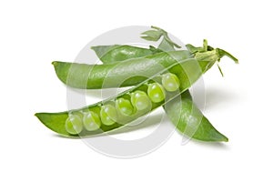 Green fresh peas isolated on white background