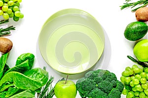 Green fresh vegetables, fruits and plate for healthy salad white background top view mock up