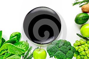 Green fresh vegetables, fruits and plate for healthy salad white background top view mock up