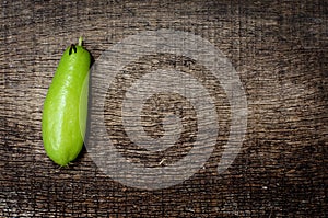 Green fruit on old wooden cracked