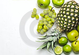 Green fruits on a white background. Fresh organic produce.