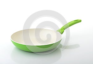 Green frying pan with ceramic coating photo