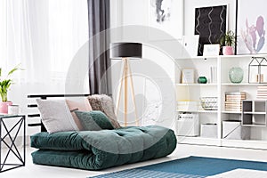 Green futon in modern bedroom photo