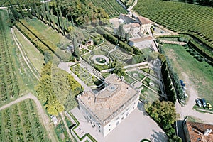 Green garden with artfully trimmed bushes and hedges near Villa Rizzardi. Valpolicella, Italy. Drone