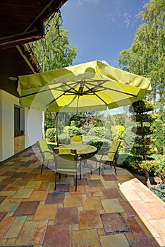 Green garden furniture with sunshade