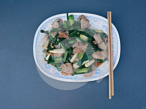 Green garlic stalks stir-fried with pork  Used to pay homage to the gods during Chinese New Year festivals.