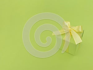 Green gift box on a green background.