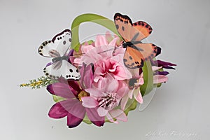 green glass basket with pink and purple flowers, and butterflies (spring collection)