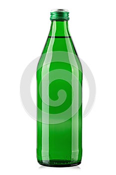 Green glass bottle of mineral water isolated on white background