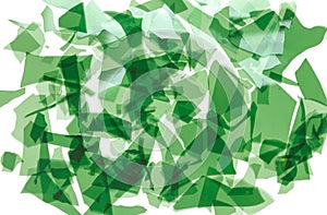 Green glass confetti. Fragments of very thin colored glass for fusing. Background image, texture