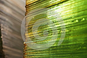 Green glass sheets stacked on top of each other