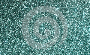 Green glitter background, festive sparkle  texture. Xmas, holiday, party abstract backdrop