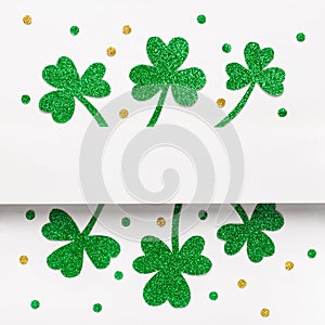 Green glitter shamrocks and confetti pattern background. Elegant St. Patricks Day background