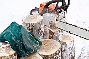 Green gloves for working with a chainsaw, personal protective equipment