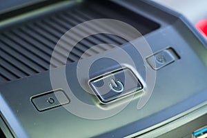 Green power button. Closeup shot.