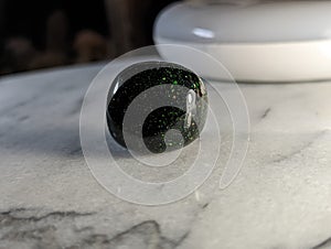 Green Goldstone on Marble Plate