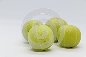 Green gooseberry fruit closeup isolated on white background