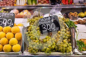 Green grape for sale. Fresh and organic vegetables and fruits at farmers market. Bunch of bio vegetables sold on market