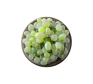 Green grapes Kishmish isolated on white. Top view. Grapes in a wooden bowl isolated on white background.