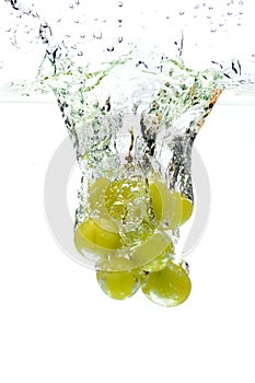 Green Grapes Splashing Into Water