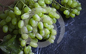 Green grapes vegetarian spring concrete backgroundn natural healthy