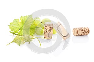 Green grapes and wine corks