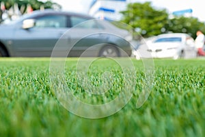 Green grass background, artificial grass field for decoration at carpark