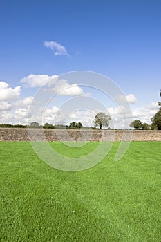 Green grass flields with stone wall