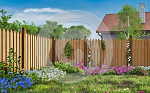 green grass and flowers lawn and wooden fence in spring backyard garden