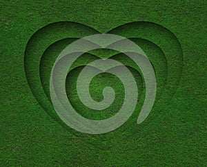 Green grass heart shape on green grass background