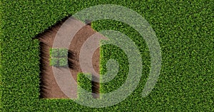 Green grass house icon shape on brown soil background cut out from grass, ecology or sustainable living concept, flat lay top view