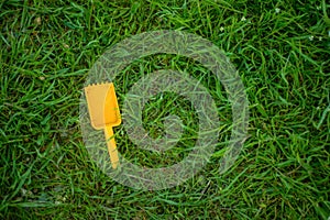 Child a spatula brighter color of lies on the grass