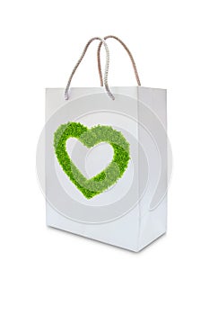 Green grass love heart on white paper bag