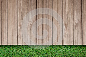 Green grass with old plank rustic wooden outdoor floor top view