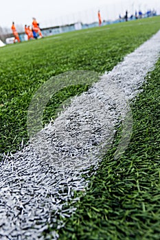 Green grass on outdoor stadium, selective focus. sport and games. healthy lifestyle. playing football field. gridiron