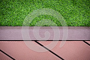 Green grass with redwalkway background