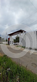 Green grass and sky view in the middle of the residential gate