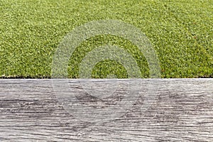 Green grass with space on grey old wood floor background