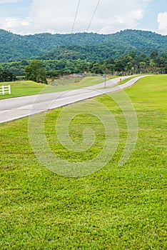 Green grass yard with bicycle lane