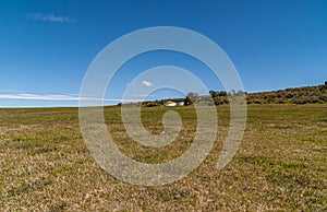 Green grassland and silo at Posada Estancia Rio Verde, Riesco Island,, Chile